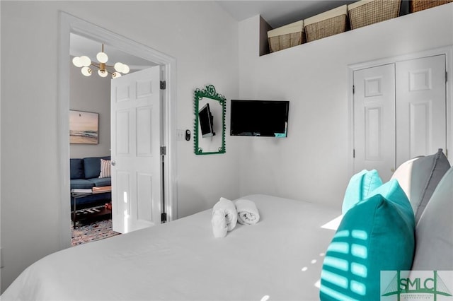 bedroom featuring an inviting chandelier