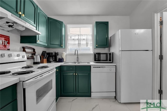 kitchen featuring under cabinet range hood, a sink, white appliances, light countertops, and green cabinetry