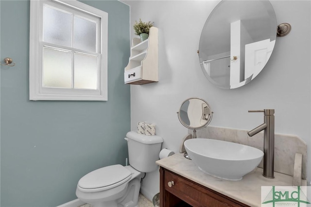 bathroom featuring vanity and toilet