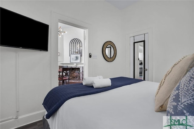 bedroom featuring wood finished floors