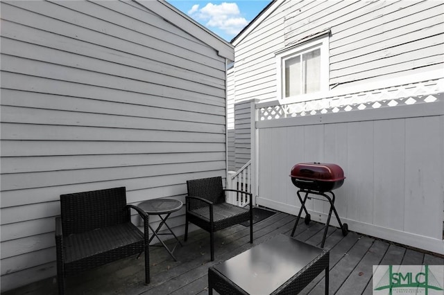 wooden deck featuring grilling area