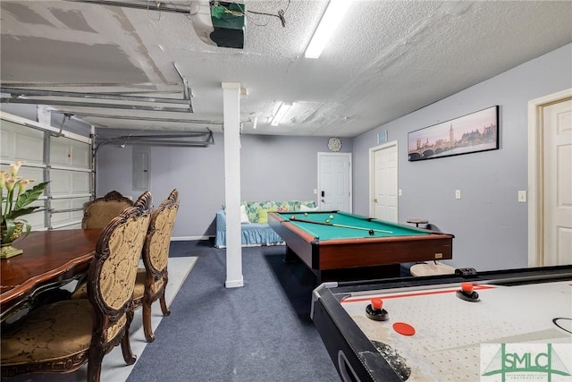 rec room with pool table, carpet, electric panel, a garage, and a textured ceiling