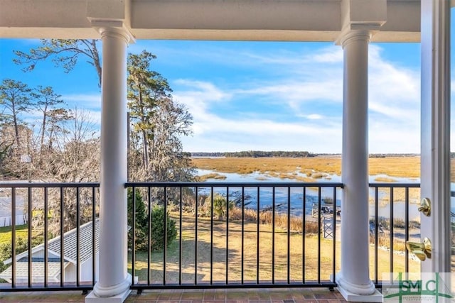 balcony featuring a water view