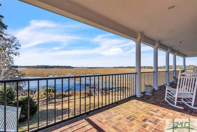 balcony featuring a water view