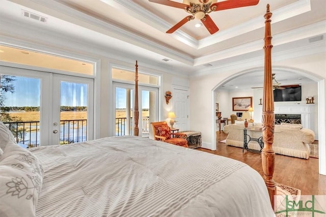 bedroom with french doors, access to outside, crown molding, and visible vents
