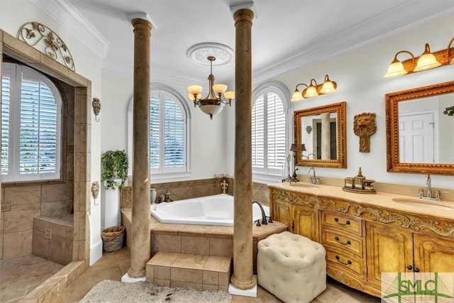 bathroom with ornamental molding, decorative columns, a garden tub, and a sink