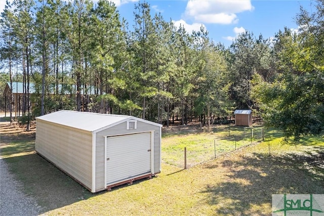 view of shed with fence