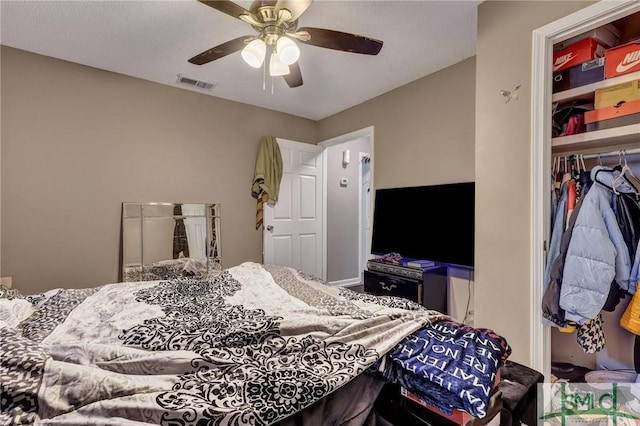 bedroom with visible vents, a closet, and ceiling fan