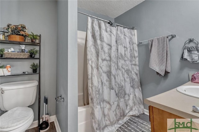 full bathroom featuring vanity, baseboards, shower / bath combination with curtain, a textured ceiling, and toilet