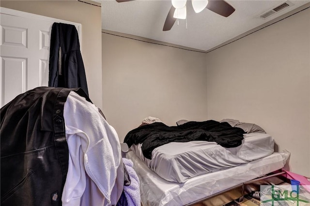 bedroom featuring visible vents and ceiling fan