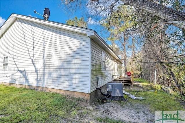 view of property exterior featuring a deck and central AC