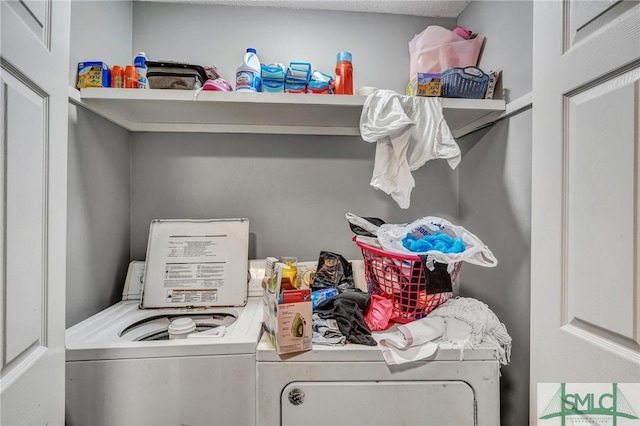 laundry room with laundry area and washing machine and clothes dryer