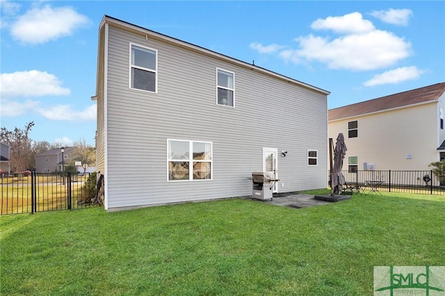 back of property featuring a patio area, a lawn, and fence