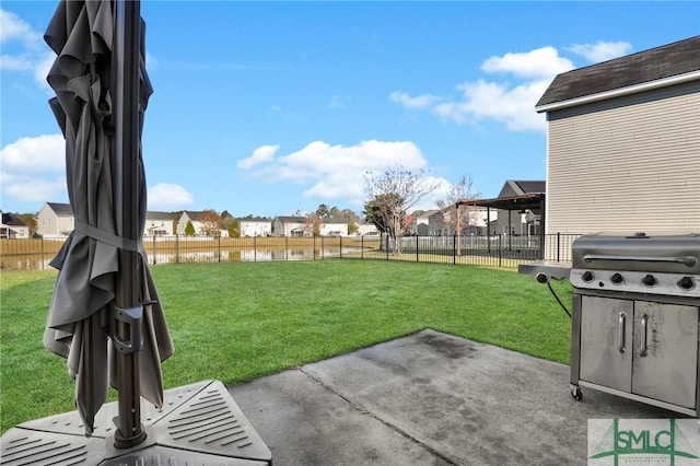 view of yard featuring a residential view, a patio, and a fenced backyard