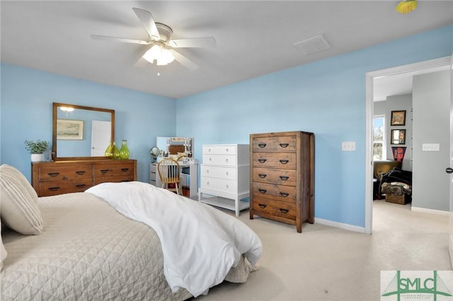 bedroom featuring light carpet, ceiling fan, and baseboards