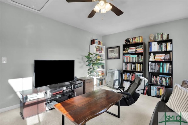 office area with baseboards and a ceiling fan