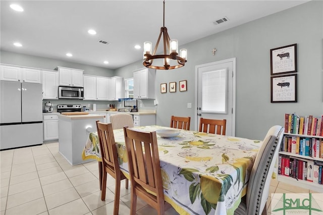 dining area featuring recessed lighting, visible vents, a notable chandelier, and light tile patterned flooring