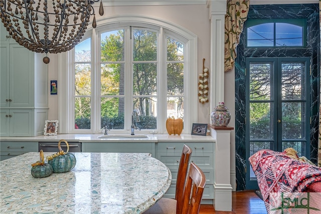 dining room featuring a healthy amount of sunlight and wood finished floors