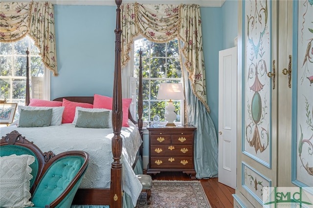 bedroom featuring wood finished floors