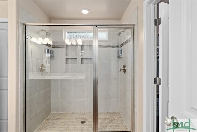 bathroom featuring a shower stall