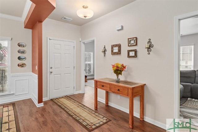 entrance foyer featuring visible vents, plenty of natural light, and wood finished floors