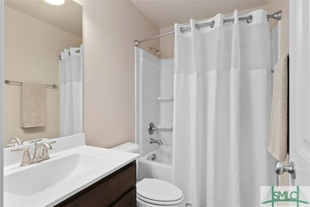 bathroom with toilet, vanity, and shower / tub combo