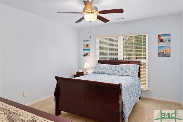 bedroom with carpet flooring, baseboards, visible vents, and ceiling fan