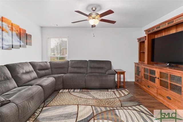 living room featuring ceiling fan and wood finished floors