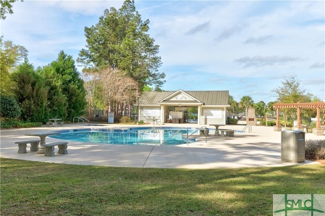 view of swimming pool featuring a yard, a patio, and a pergola