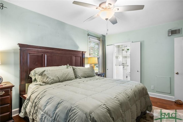 bedroom with dark wood finished floors, baseboards, visible vents, and ceiling fan