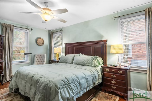 bedroom featuring wood finished floors and a ceiling fan