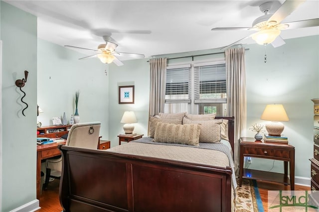 bedroom with baseboards, wood finished floors, and a ceiling fan