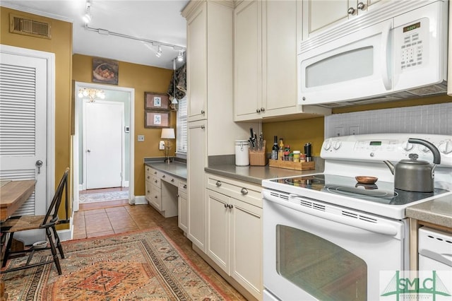 kitchen featuring white appliances, light tile patterned flooring, visible vents, and track lighting