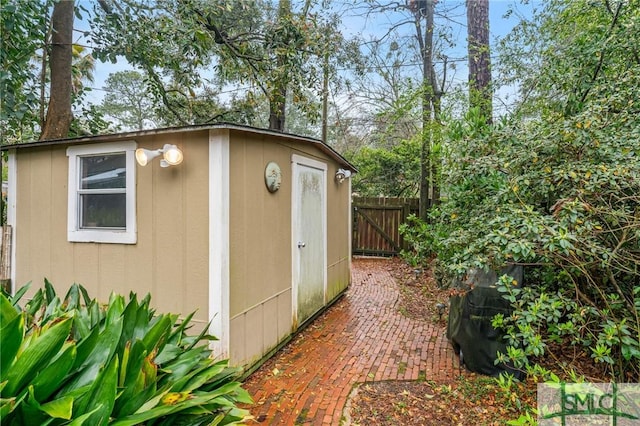 view of shed with fence