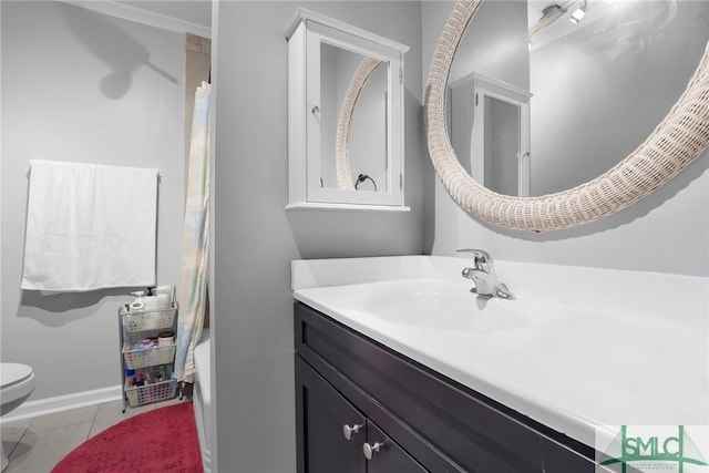 bathroom featuring vanity, tile patterned floors, and toilet