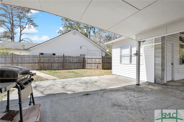 view of patio featuring fence and grilling area