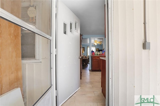 corridor featuring light wood finished floors