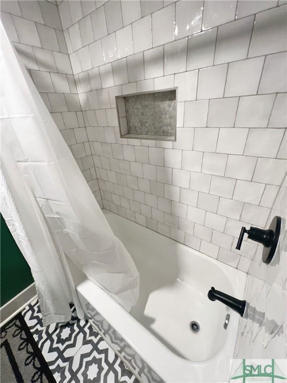 bathroom with a shower with shower curtain