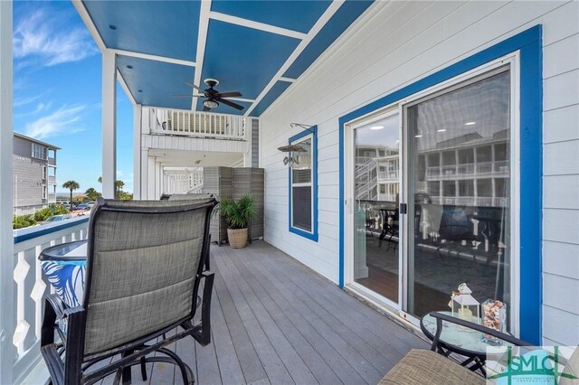 wooden deck with ceiling fan