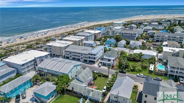 drone / aerial view with a water view and a view of the beach