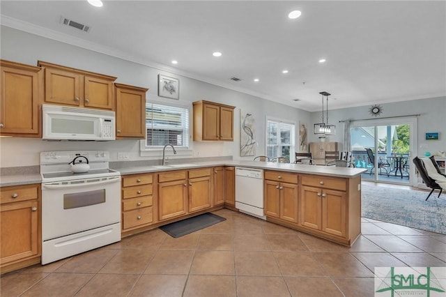 kitchen featuring white appliances, light tile patterned floors, visible vents, a peninsula, and a sink