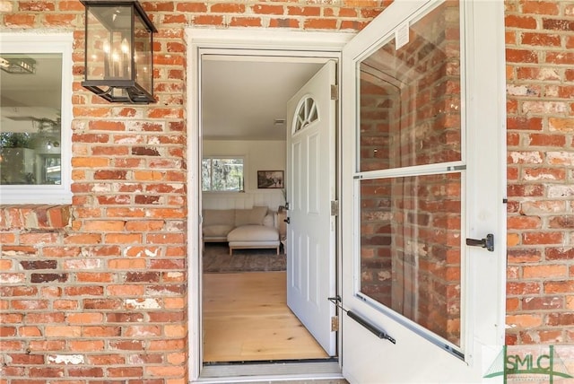 entrance to property with brick siding