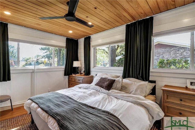 bedroom with wood finished floors, multiple windows, wooden ceiling, and recessed lighting