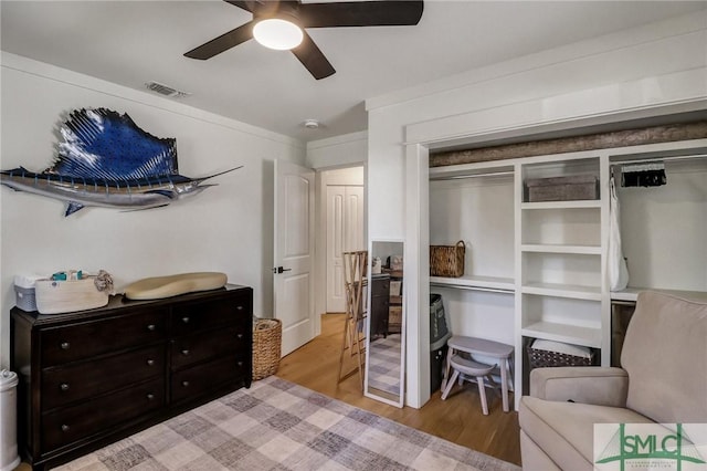 bedroom featuring visible vents, light wood-type flooring, and ceiling fan