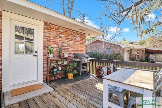 wooden terrace with grilling area