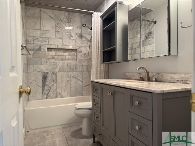 bathroom featuring toilet, vanity, and shower / bath combo