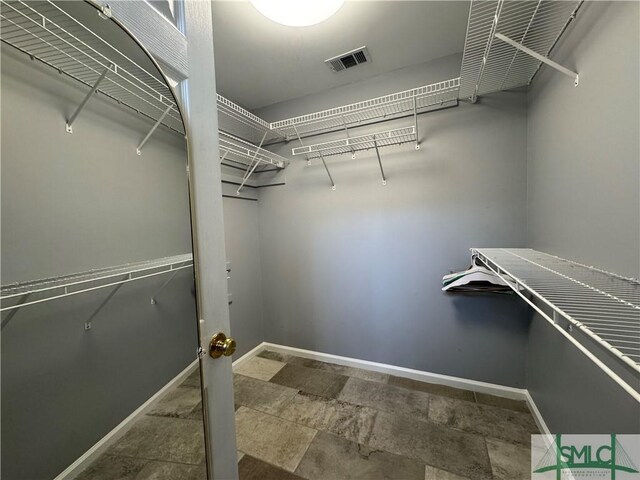 walk in closet featuring visible vents