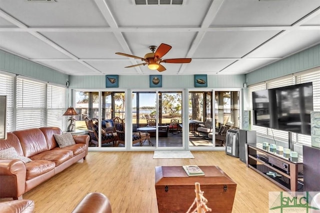 living room with ceiling fan, visible vents, coffered ceiling, and wood finished floors