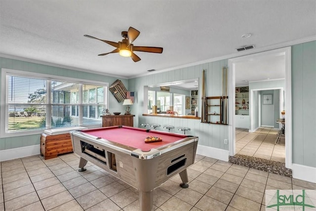 playroom featuring visible vents, ornamental molding, and light tile patterned flooring