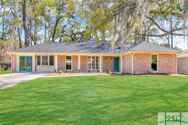 ranch-style home with brick siding and a front lawn